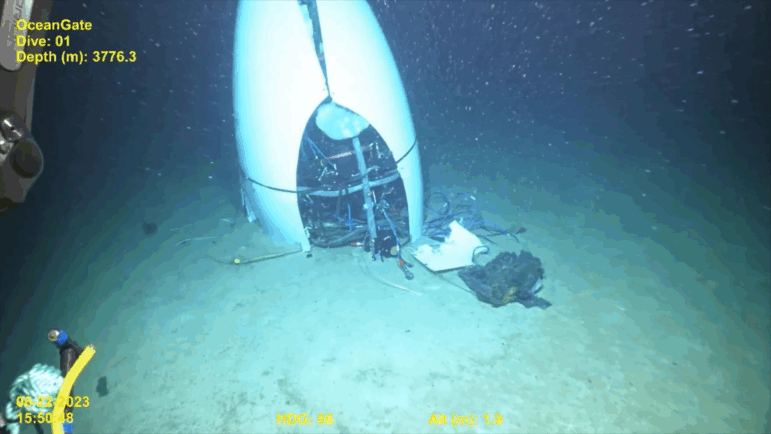 A still photo from a video recording shows the OceanGate Titan submersible on the ocean floor following an implosion in 2023. Five people died in the accident.