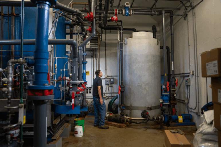 Chris Hughes, assistant water and wastewater operator for the towns of Cavendish and Proctorsville in Vermont, deals with the effects of a power outage at a drinking water facility.