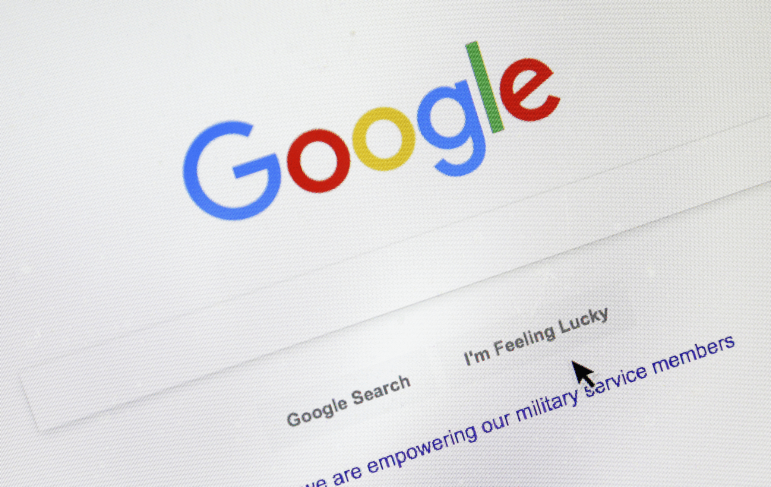 A cursor moves over Google's search engine page, in Portland, Ore., on Aug. 28, 2018. The most valuable information Google is being forced to share under Judge Amit Mehta's ruling is users’ click-and-query data. That refers to the information Google collects from users about what they search for (the queries) and what links they select (the clicks).