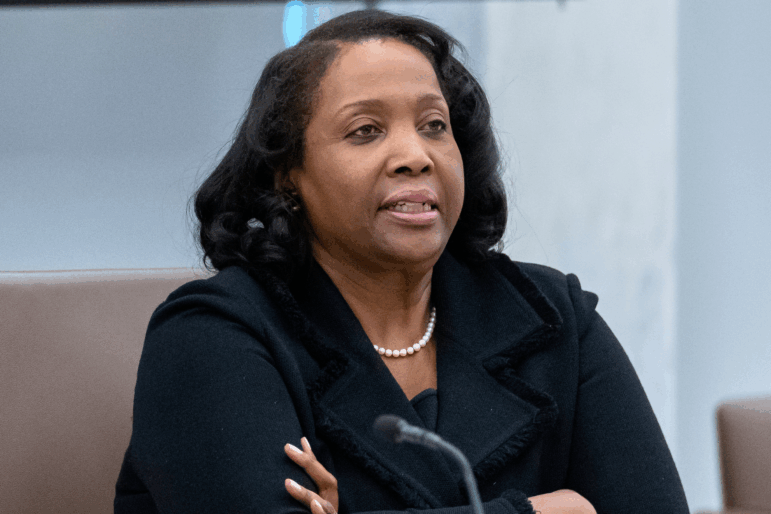Federal Reserve Board of Governors member Lisa Cook listens during an open meeting of the board at the Federal Reserve in Washington on on June 25.