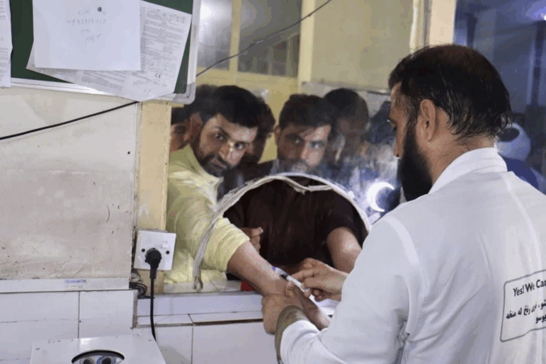 In this photo released by the Ministry of Public Health, Afghans donate blood for victims of an earthquake that killed hundreds and destroyed numerous villages in eastern Afghanistan, at Nangarhar Regional Hospital in Nangarhar, Monday, Sept. 1, 2025. (Afghanistan Ministry of Public Health via AP)