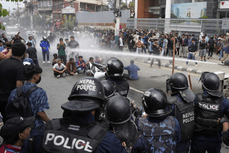 Riot police use a water cannon on protesters outside Parliament in Kathmandu, Nepal, Monday, Sept. 8, 2025.