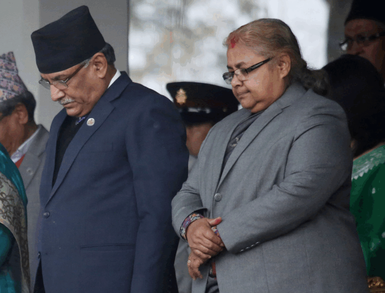 Nepal's then-chief Justice of the Supreme Court, Sushila Karki (right), observes a minute's silence during Democracy Day in Kathmandu, Nepal, Feb. 18, 2017.