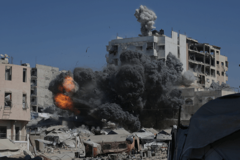 Smoke and flames rise after an Israeli military strike on a building in Gaza City, Friday, Sept. 12, 2025.