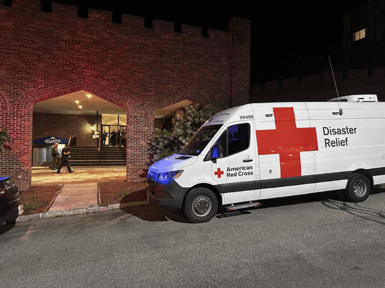 An American Red Cross Disaster Relief van is parked outside a hotel that is acting as a reunification center after a shooting at a country club in Nashua, New Hampshire, Saturday, Sept. 20, 2025.