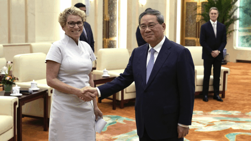Chrissy Houlahan, Democratic member of House Armed Services Committee, left, poses for a photo with Chinese Premier Li Qiang at the Great Hall of the People in Beijing, China on Sunday.