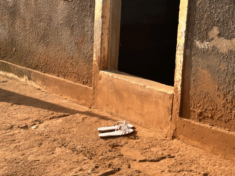 Sandals outside a brothel on the Uganda-Kenya highway.