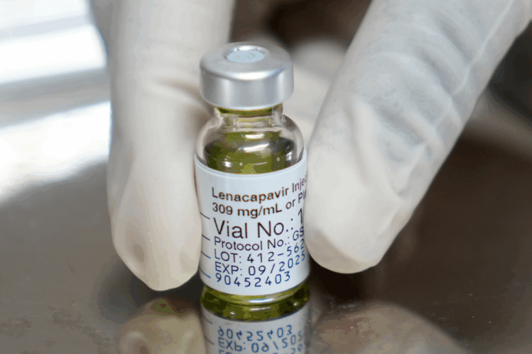 FILE - A pharmacist holds a vial of lenacapavir, the new HIV prevention injectable drug, at the Desmond Tutu Health Foundation's Masiphumelele Research Site, in Cape Town, South Africa, Tuesday, July 23, 2024, which was one of the sites for Gilead's lenacapavir drug trial. (AP Photo/Nardus Engelbrecht, File)