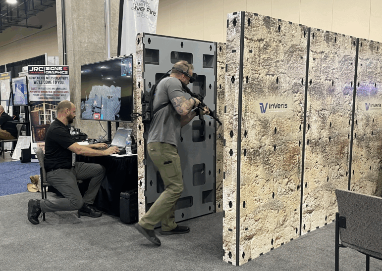Chris Myers, a school resource officer in Daviess County, Indiana, participates in an augmented reality training simulator. The simulation, run by Christian Carrillo for InVeris Training Solutions, put Myers in a realistic school shooting scenario.