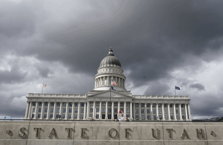 A women takes a picture at the Utah State Capitol on May 3, 2022 in Salt Lake City.