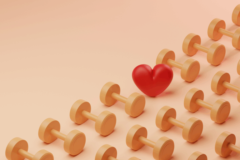 Conceptual image of a grid pattern of yellow dumbbells covering half the screen with a single red heart in between, could illustrate ideas around heart health and exercise or love for working out