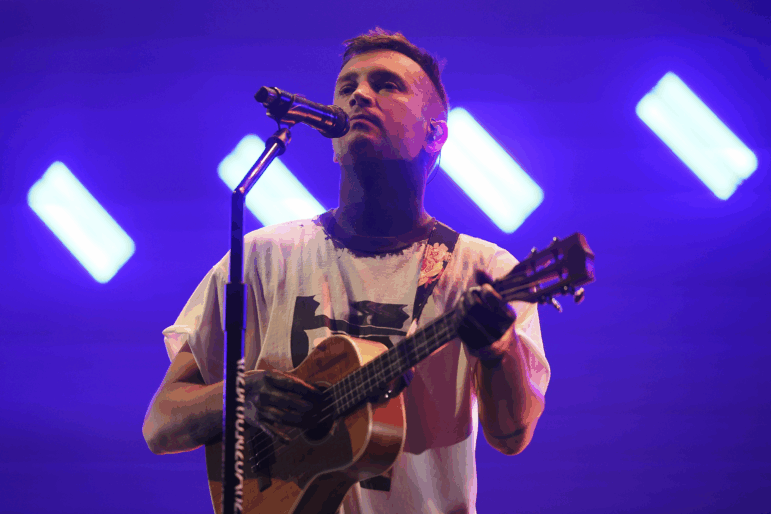 Tyler Joseph of Twenty One Pilots performs on stage in 2024.