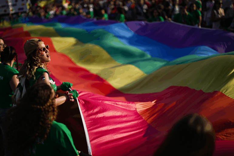 Participants hold onto a large rainbow flag during the annual Pride Parade in support of LGBTQ rights in Athens on June 14.
