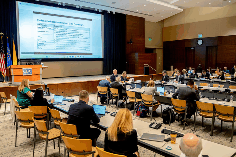 Members of the Advisory Committee on Immunization Practices meet at the Centers for Disease Control and Prevention headquarters in Atlanta, Ga. in June. The US Centers for Disease Control and Prevention's vaccine panel is adding new subcommittees to review the current childhood immunization schedule and examine shots that haven't been studied in at least seven years, its chairman said Wednesday. Photographer: Ben Hendren/Bloomberg via Getty Images