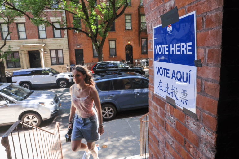A voter arrives to cast a ballot in the mayoral primary election on June 24 at the Park Slope Armory YMCA in the Brooklyn borough of New York City.