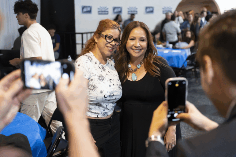 Democratic U.S. congressional candidate Adelita Grijalva poses with supporters at a primary election-night party at El Casino Ballroom on July 15, 2025, in South Tucson, Ariz. Grijalva said social media is important but it is just one tool in a tool kit that needs to include grassroots organizing, coalition building and talking with people.