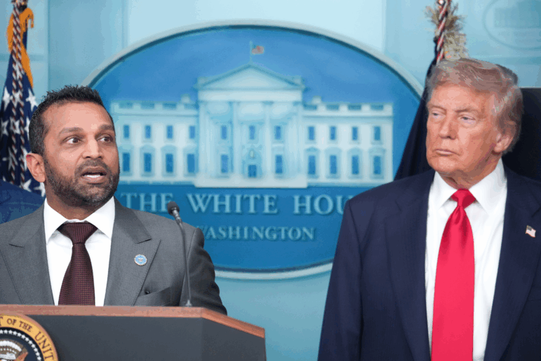 FBI Director Kash Patel delivers remarks as U.S. President Donald Trump looks on during a White House press conference in August 2025.