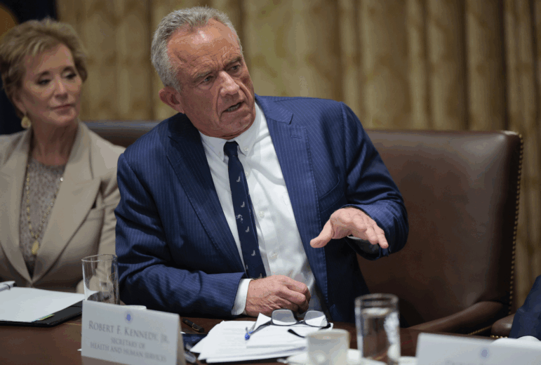 Health Secretary Robert F. Kennedy Jr. and Education Secretary Linda McMahon are pictured. Kennedy is speaking; McMahon is on the left.