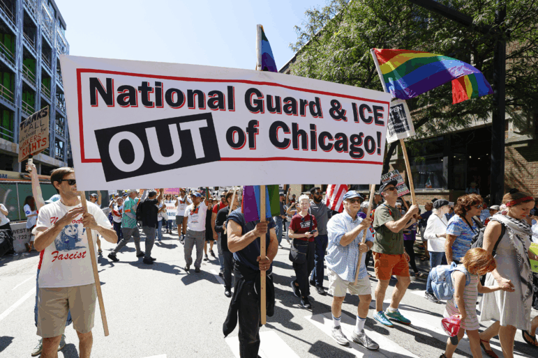Protesters at a Labor Day protest Trump's threatened National Guard deployment in Chicago.
