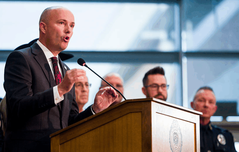 Utah Gov. Spencer Cox speaks at a press conference flanked by FBI Director Kash Patel following the fatal shooting of political activist Charlie Kirk on Friday in Orem, Utah.