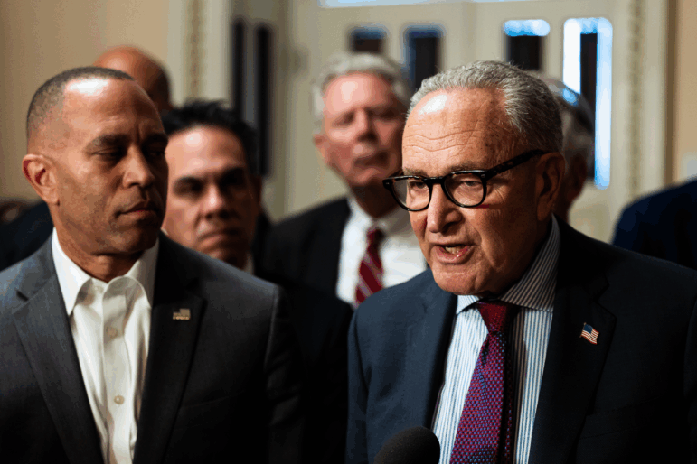 Senate Minority Leader Charles Schumer and House Minority Leader Hakeem Jeffries speak with members of the press on Capitol Hill on Sept. 11.