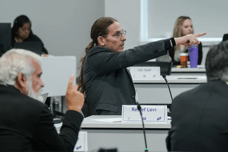 ACIP member Retsef Levi points to a slide while speaking during a meeting of the CDC's Advisory Committee on Immunization Practices on September 18, 2025 in Atlanta, Georgia. The federal vaccine advisory group, recently appointed by Health Secretary Robert F. Kennedy Jr., made recommendations Friday on the COVID vaccine.