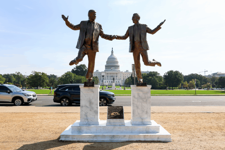 A statue depicting President Donald Trump and Jeffrey Epstein holding hands is seen near the U.S. Capitol on Tuesday.