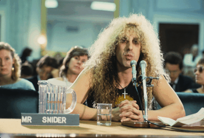Dee Snider of American metal band Twisted Sister appears at the PMRC senate hearing on Capitol Hill on Sept. 19, 1985. Representatives of the Parents Music Resource Center, senators and musicians testified before the Senate Commerce, Science and Transportation Committee on 'the subject of the content of certain sound recordings and suggestions that recording packages be labeled to provide a warning to prospective purchasers of sexually explicit or other potentially offensive content'.