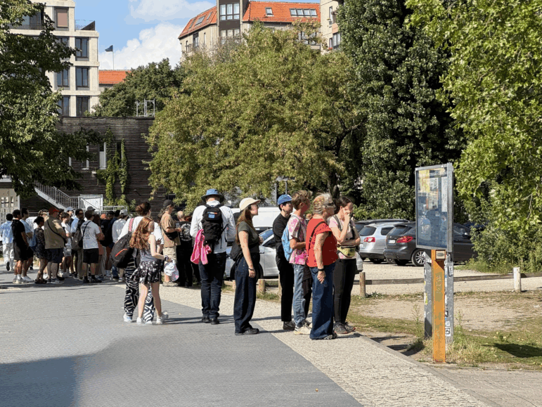 Tourists gather at a parking lot in the center of Berlin, Germany.