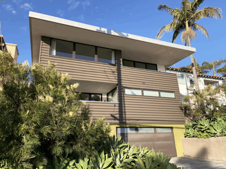 The Fortunato's Green Idea House in Hermosa Beach, Calif. has a flat roof with a five foot overhang that shields the sun and cools the home.