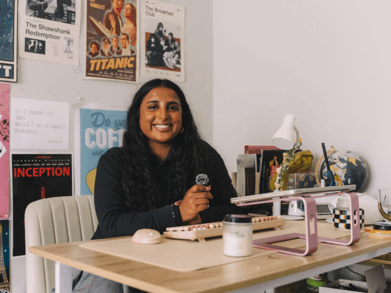 Avani Yaltho, the 2025 high school winner of NPR's Student Podcast Challenge, poses for a portrait in her room with her recording setup in Houston.