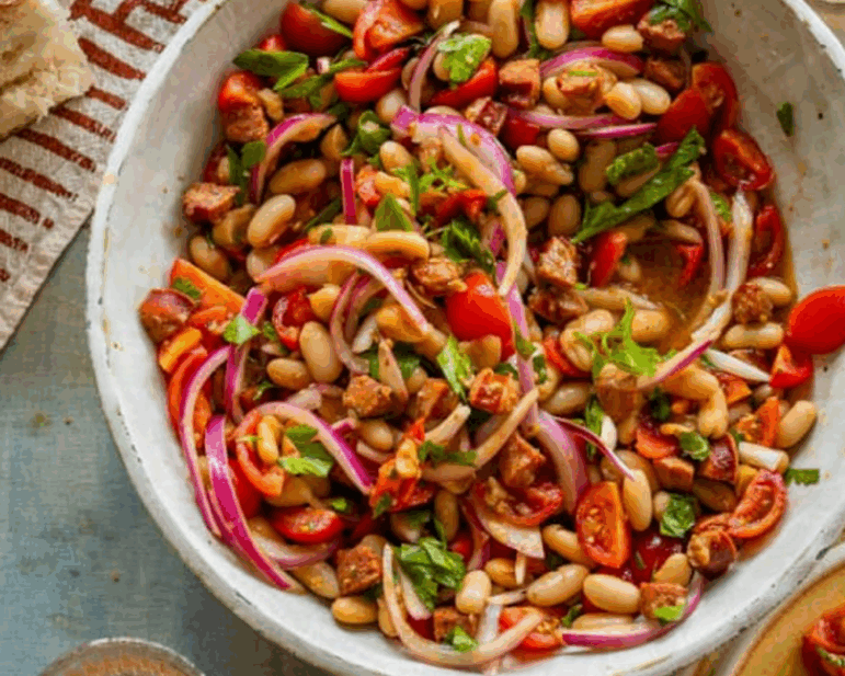 White beans and chorizo with quick-marinated tomatoes and onions are a delicious way to say goodbye to summer.