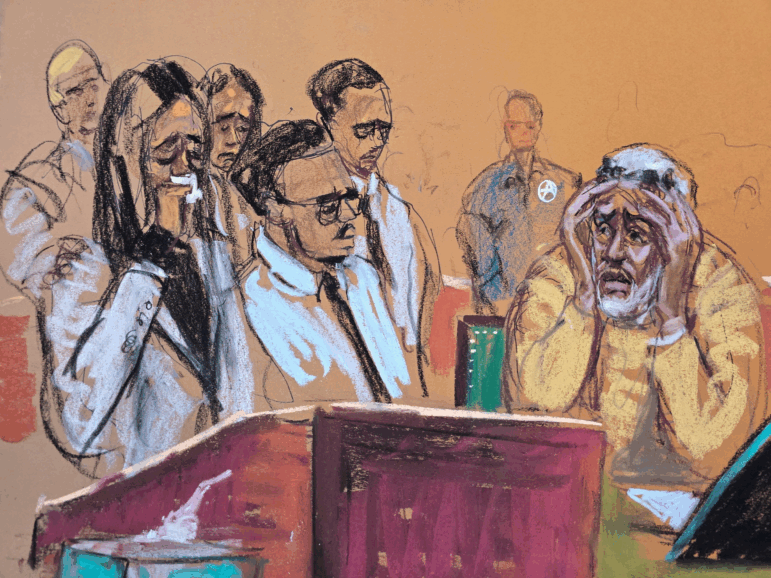 Sean Combs (at right) watches his children present impact statements during his sentencing hearing in New York. Combs was sentenced to 50 months in prison.