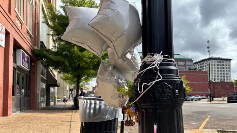 Star-shaped balloons and flowers were tied to street lights in downtown Montgomery.