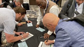 Sellers sign up for five-minute meetings with a representative from the Mazda-Toyota plants in Alabama at the Southern Automotive Conference in Huntsville, Alabama, on October 7, 2025.