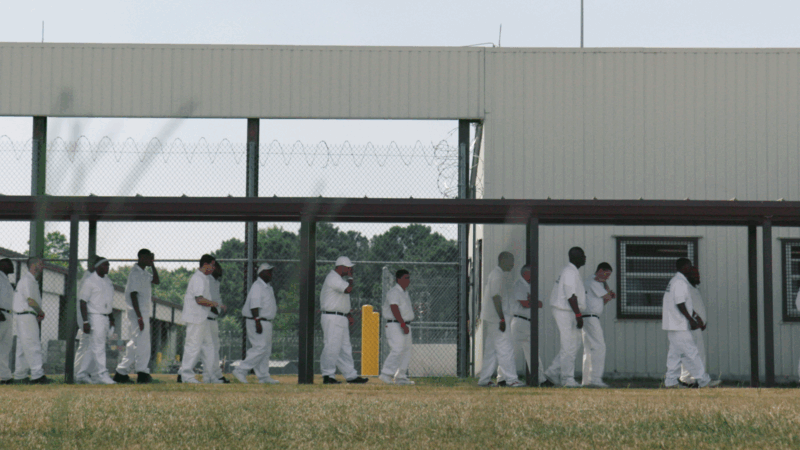 https://wbhm.org/wp-content/uploads/2025/10/Men_lining_up_at_Easterling-800x450.png