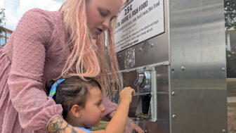 Rachel Ramos and her daughter, Raina, feed ducks at a Huntsville, Alabama, park on September 22, 2025.
