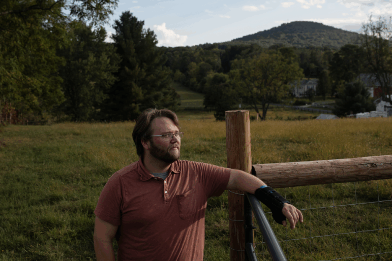 Andrew Tait works at a factory and lives with his partner and their daughters on a small farm in rural Virginia. He worries about inflated prices and is concerned about their family's financial future.