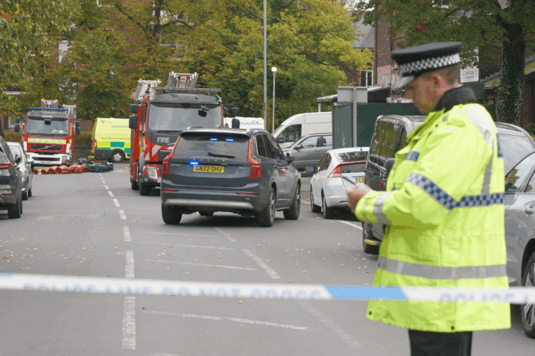 Police guard a cordon at the scene of a stabbing incident at Heaton Park Hebrew Congregation synagogue, in Crumpsall, Manchester, England.
