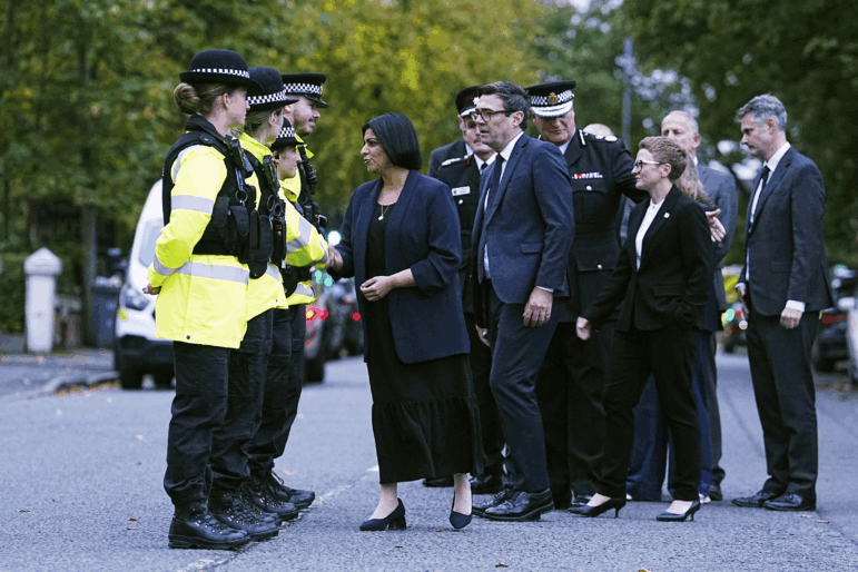 Britain's Home Secretary Shabana Mahmood, left, visits the scene following the incident at Heaton Park Hebrew Congregation synagogue in Crumpsall, Manchester, Thursday, Oct. 2, 2025.