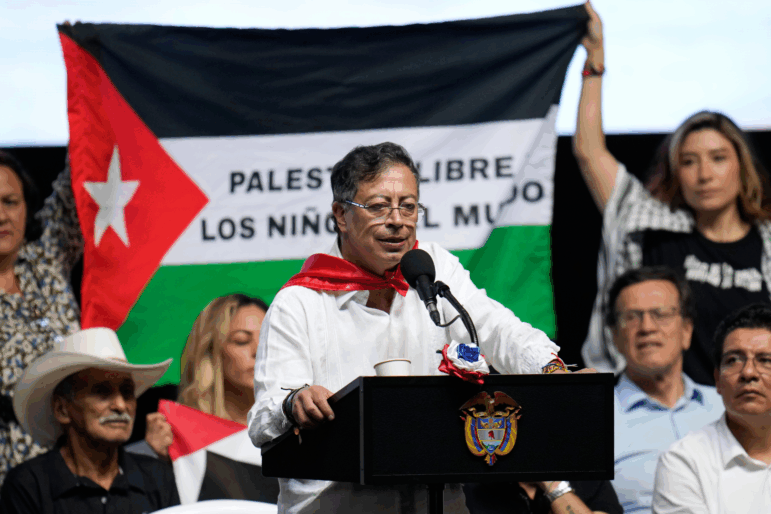 Supporters of Colombian President Gustavo Petro display a Palestinian flag as he addresses a rally in Ibague, Colombia, Oct. 3, 2025.