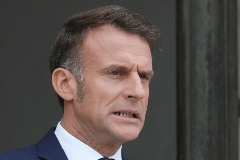 French President Emmanuel Macron, seen waiting for Jordan's Crown Prince Hussein in Paris on Wednesday, has reappointed the same prime minister who resigned days earlier, asking him to try forming a government again.