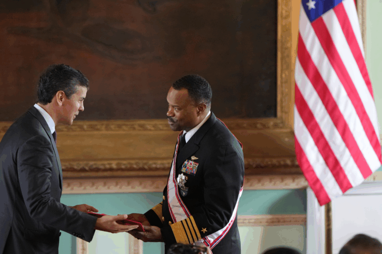 Paraguay's President Santiago Peña awards the Order of Merit "Gral Div Bernardino Caballero" in the grade of "Gran Cross", to Navy Adm. Alvin Holsey, commander of U.S. Southern Command, at Government Palace in Asuncion, Paraguay, Aug. 23, 2025.
