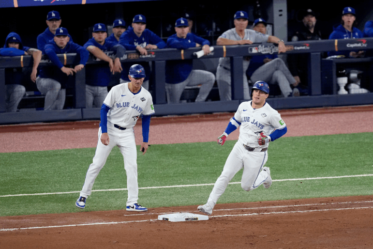 Toronto Blue Jays' Daulton Varsho runs past the Los Angeles Dodgers dugout after hitting his two run home run during the fourth inning in Game 1 of baseball's World Series, on Friday in Toronto.