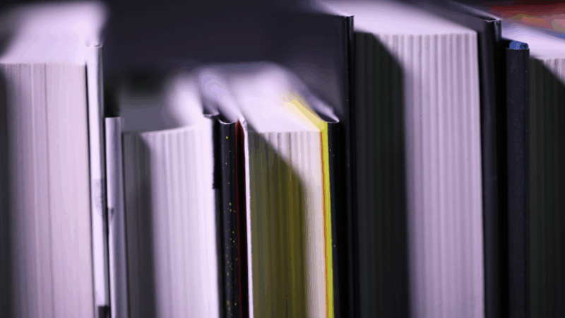 https://wbhm.org/wp-content/uploads/2025/10/book-pages-lined-up-2-credit-becky-harlan-npr-800x450.png
