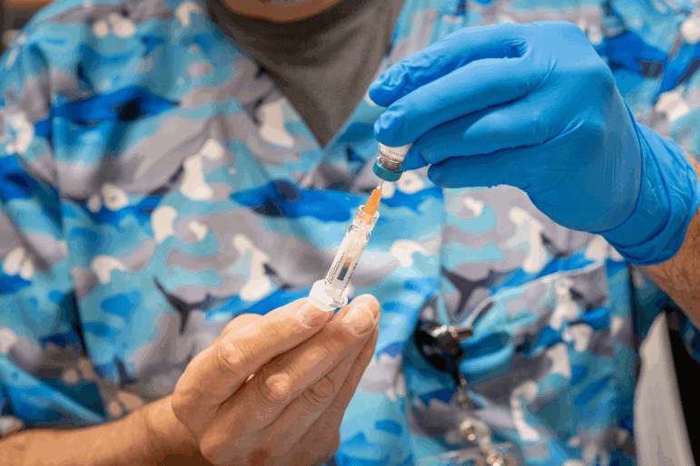 Raynard Covarrubio fills a syringe with the MMR vaccine, at a vaccine clinic put on by Lubbock Public Health Department on March 1 in Lubbock, Texas. West Texas saw a measles outbreak this year.