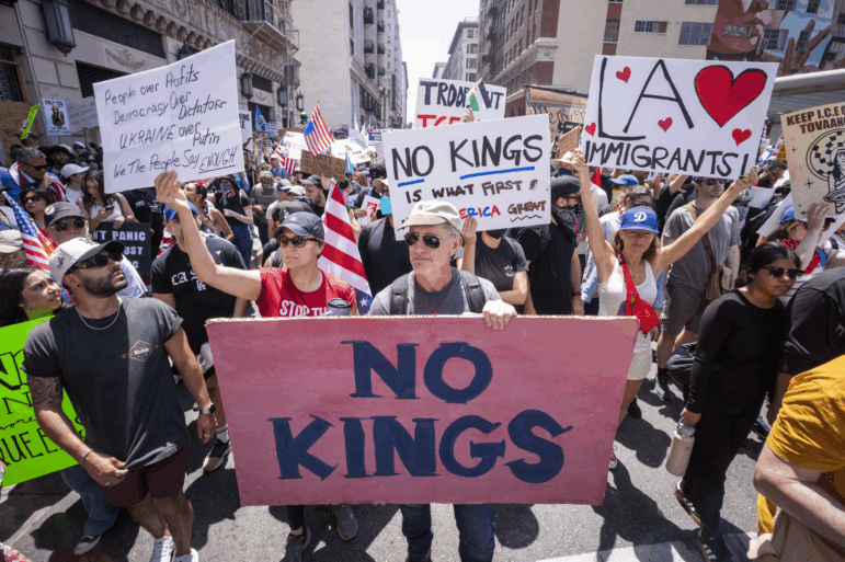 Demonstrators take part in a protest against the Trump administration during the "No Kings" national rally in downtown Los Angeles on June 14, 2025, on the same day as President Trump's military parade in Washington, D.C.