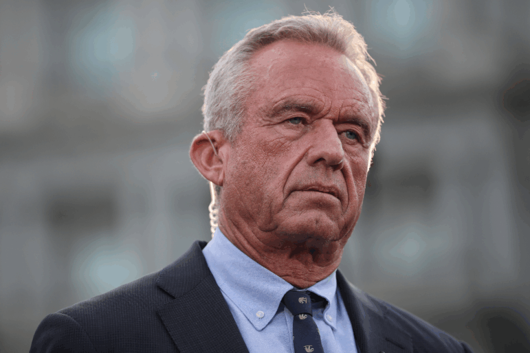 Health Secretary Robert F. Kennedy Jr. is shown in a head and shoulders photograph; he is wearing a suit.