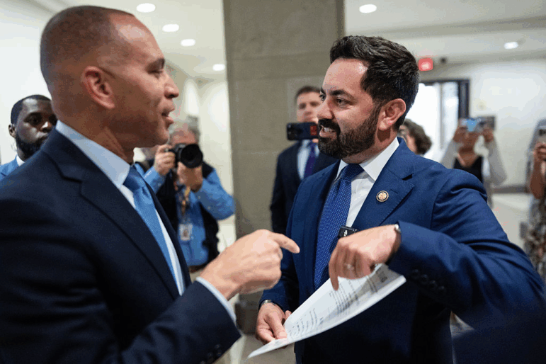 Representative Mike Lawler (right), R-N.Y., confronts House Minority Leader Hakeem Jeffries, D-N.Y., about signing on to a bill that would extend Affordable Care Act tax credits, on October 8.