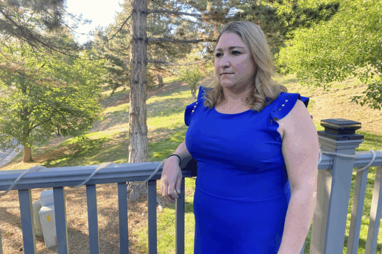 Stephanie Rogers at her mother’s home outside Denver, where she and her two daughters now live. Rogers has dipped into her retirement to help the family get through the federal shutdown.